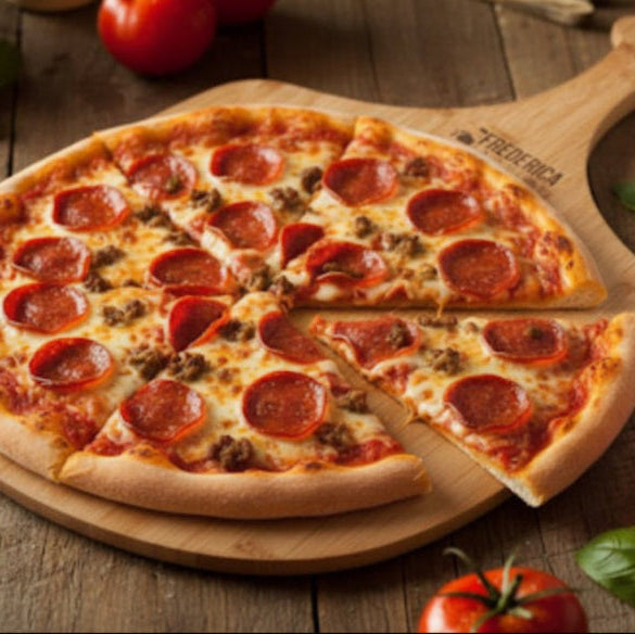 Pepperoni pizza on a wooden board with tomatoes and basil in the background