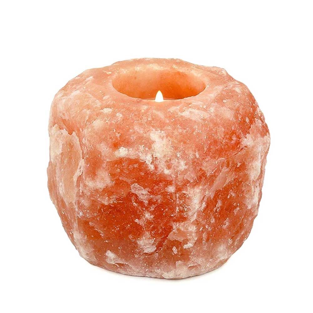 "Pride of India handcrafted Himalayan pink salt tea light holder with a natural organic shape, isolated on white background."