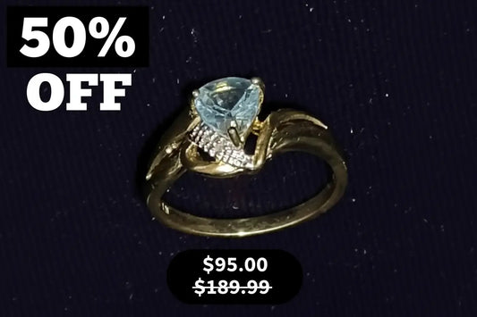 Beautiful Womens 14K Yellow Gold Over Sterling Silver Diamonds and 1 CTW Swiss Blue Topaz Size 7 Designer Ring, shown on a dark textured background with '50% OFF' and '$95.00 was $189.