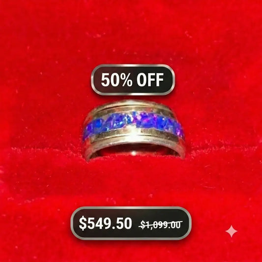 A solid 14k gold ring with a sterling silver accent ring and a 14 karat gold accent ring with a vibrant blue iridescent inlay, displayed on a red velvet ring box with promotional text overlays reading '50% OFF' was   $1,999 now $549.50
