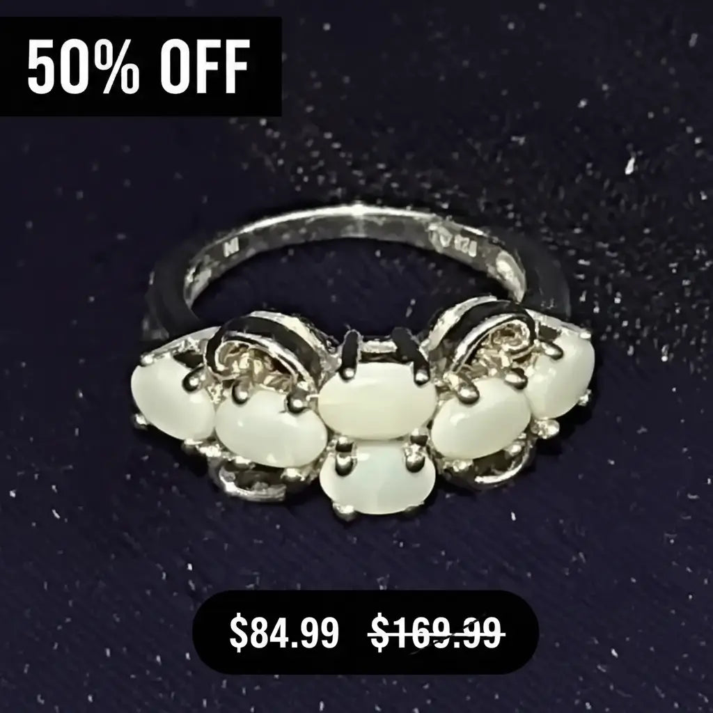 A Whimsical Women's Sterling Silver 1.68 CTW Beautiful Opal Size 8 Ring, displayed on a dark textured background with promotional text overlays reading '50% OFF' and '$84.99 $169.