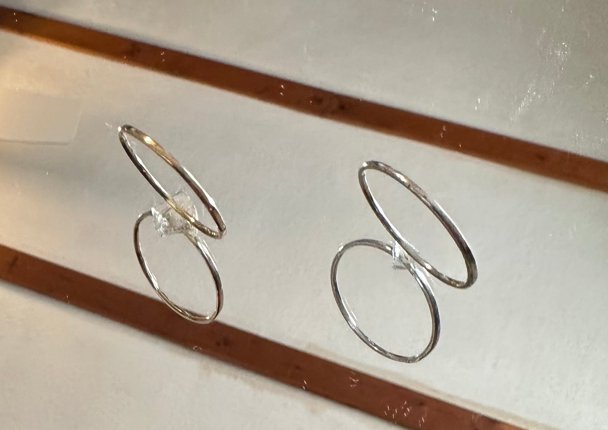 Masterwork Artisan Trio gold and silver ring set. on a mirror 