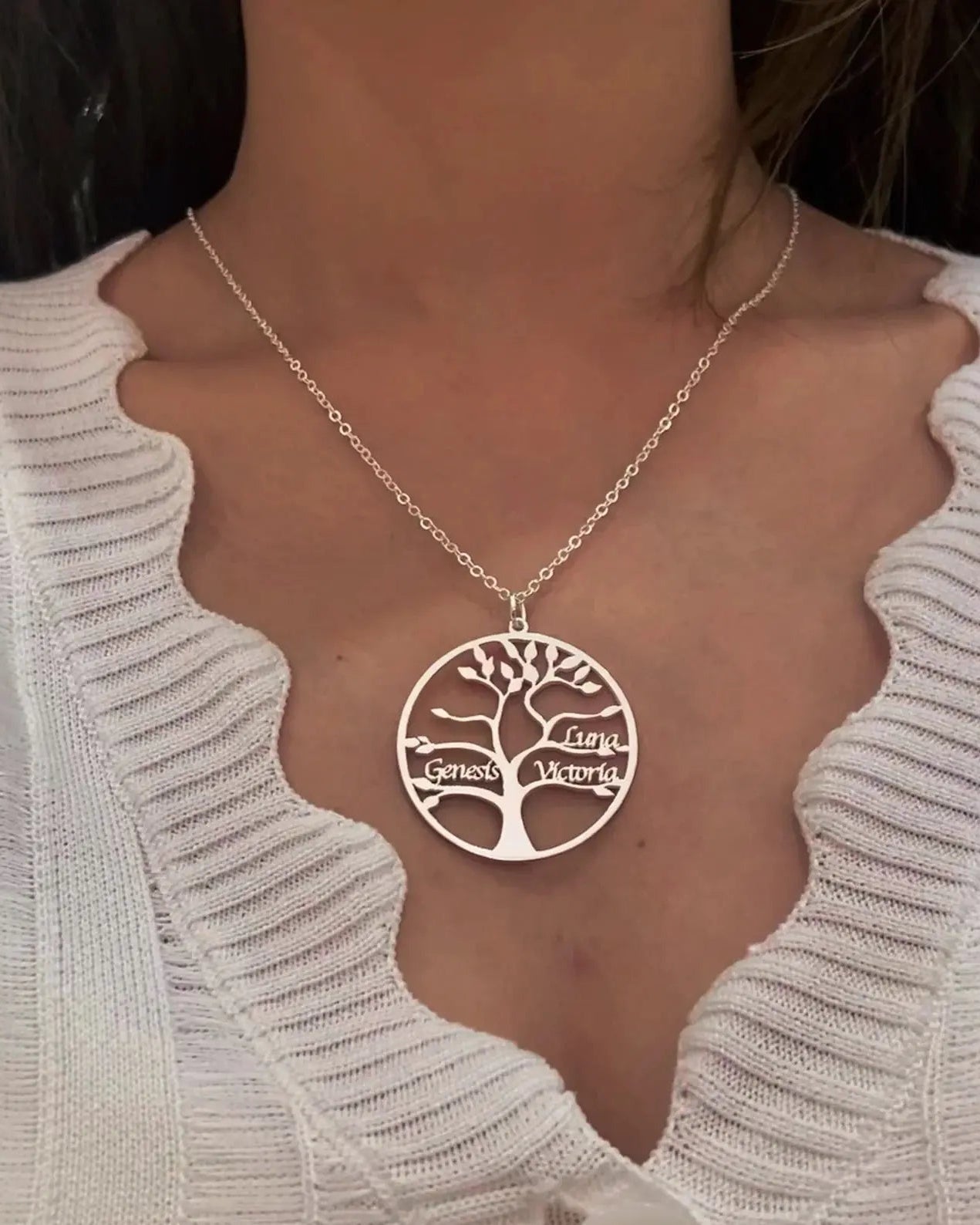 Hand-made silver tree of life necklace featuring personalized name script.