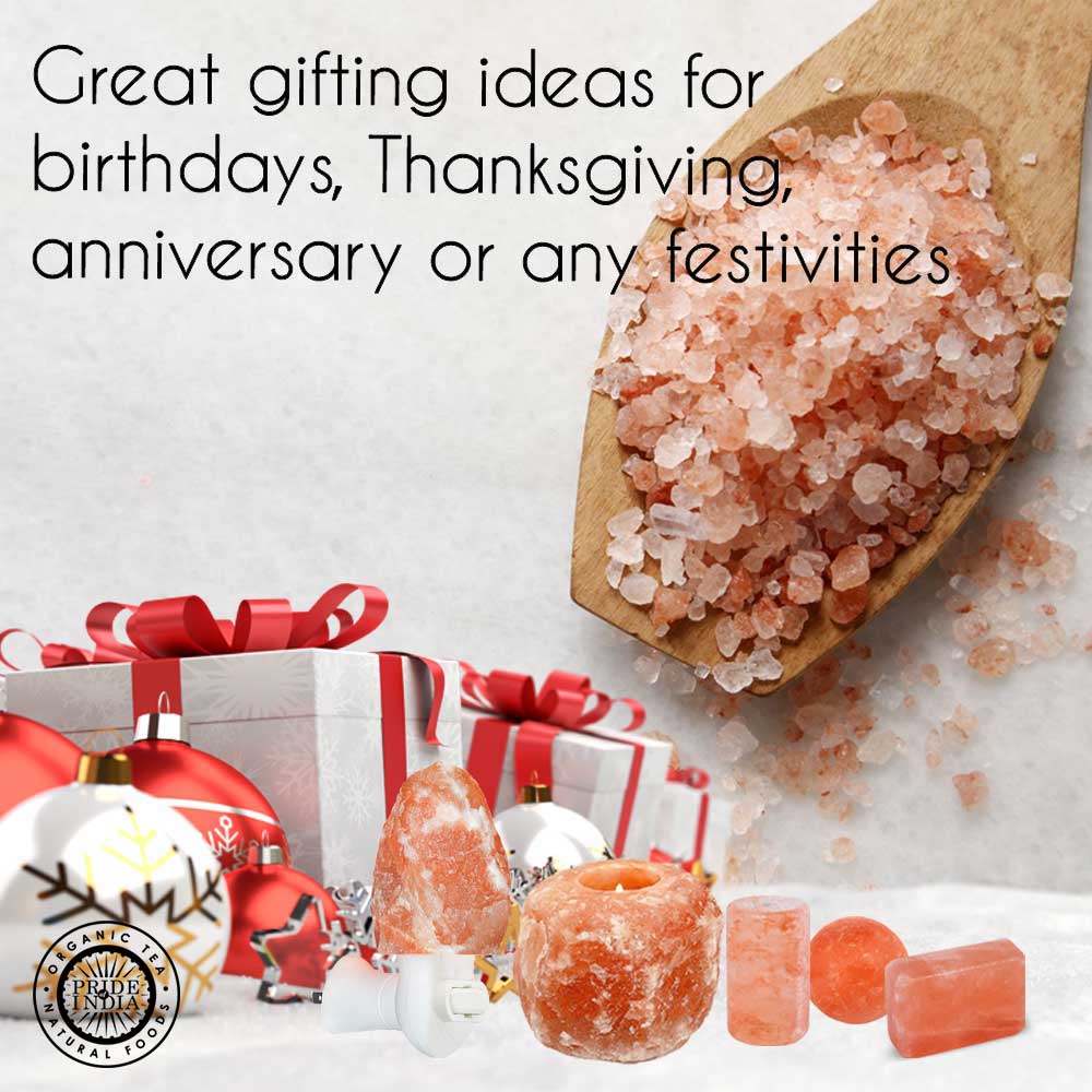 Himalayan pink salt gift set featuring a tea light holder, natural salt lamp, and coarse salt crystals with festive gift boxes.