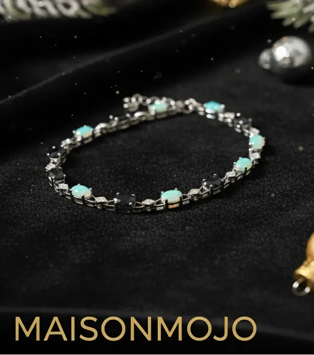 Bracelet on crushed black velvet with 'MAISONMOJO.COM' text, decorative elements around