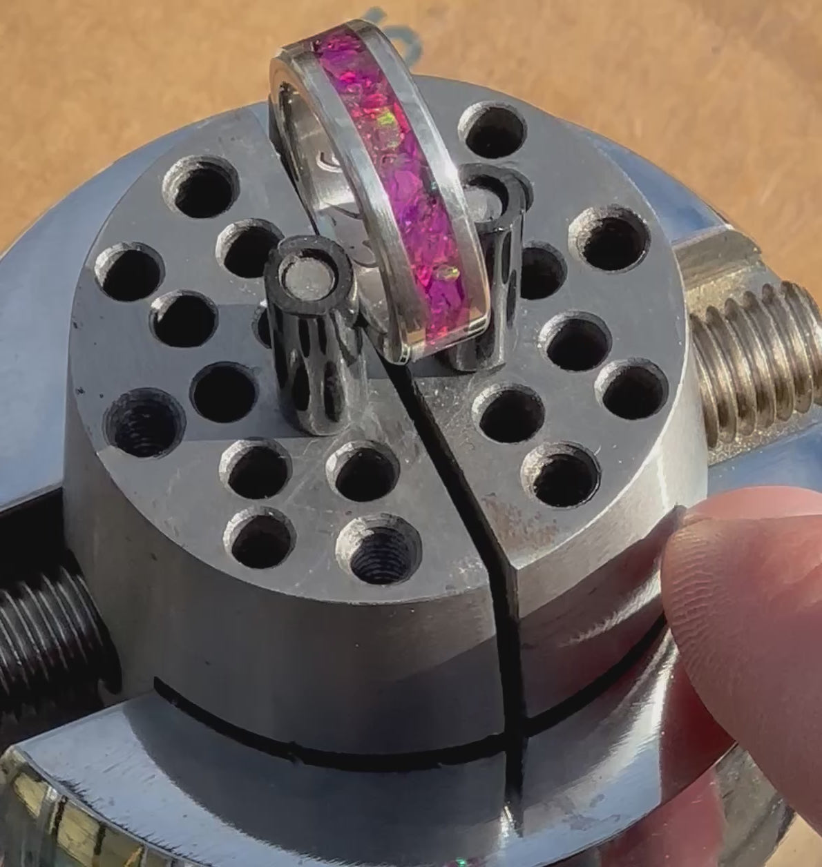 "Cosmic Heart" Archive Band: Pink Fire Opal & .925 Silver Size: 6.5, on a Jewelers ball vise.